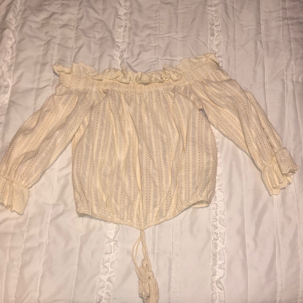 Off the shoulder cream shirt